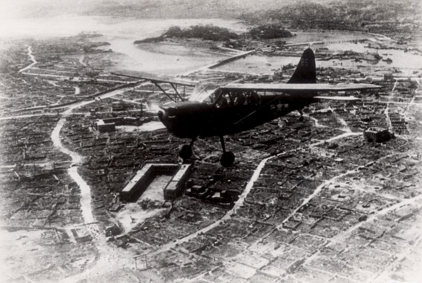 An American plane conducting an air raid on Naha. ©Naha City Museum of History